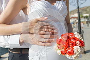 Hands of newly wedded after wedding ceremony