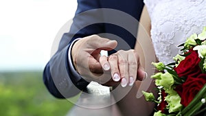 Hands of newlyweds on their wedding day