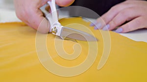 Hands notch tailor tailor's scissors cloth cutting a piece of fabric. fashion designer concept