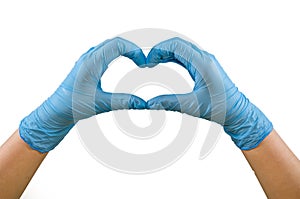 Hands of a nurse in blue latex gloves. The heart is made of hands.