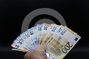 Hands offering euro bills photo