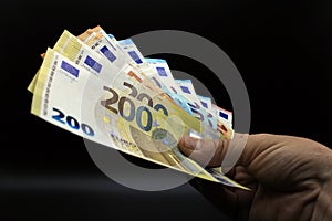 Hands offering euro bills photo