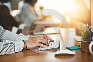 Hands, office or man typing on computer working on business project or online research at desk. Person, closeup or male