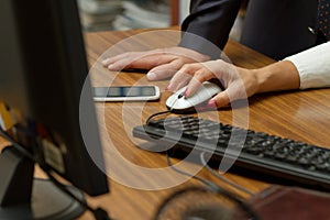 Hands of office workers at work