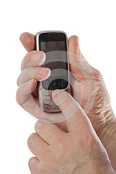 Hands of old man with old mobile phone