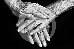 Hands of an old man and an old woman