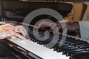 elder hands of a piano player