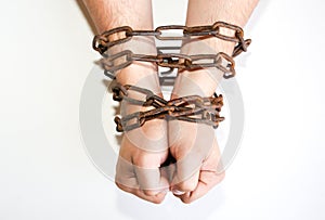 Hands in old rusty chains. Man in the trap. Slave concept