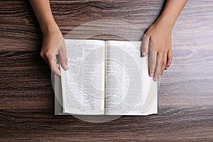 Hands With Open Bible