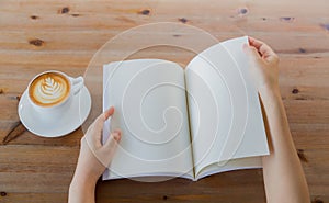 Hands open Blank catalog, magazines,book mock up on wood table