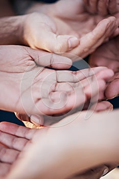 Hands open together, solidarity and community of charity, support or kindness with gratitude. Group of people with palm