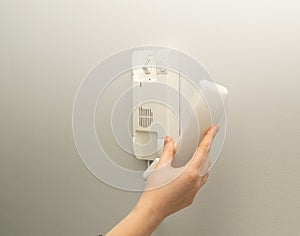 Hands opening door through intercom