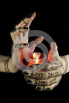 Hands with oriental tattoo photo