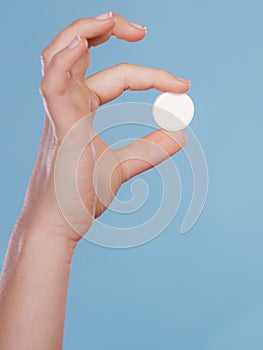 Hands with painkiller pill tablet. Health care.