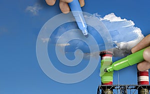 Hands painting blue and green pollution from a chimney