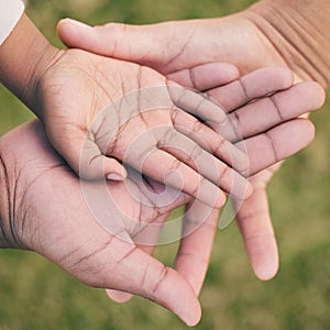 Hands palm close up, kid and parents for family, love or support in summer on vacation at park. Helping hand, solidarity