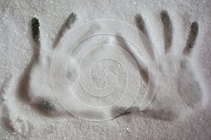 Hands palm prints on fresh snow