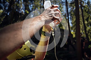 Hands of paramedic holding infusion