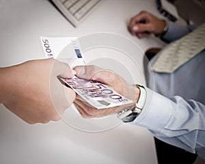 Hands passing money