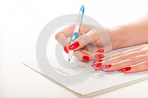 Hands with pen signing document