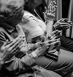 Hands of people applauding at wedding ceremony. group of elderly