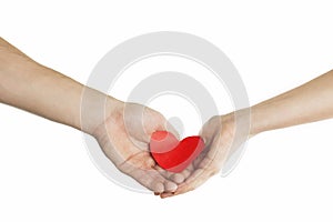 Hands of people hold red heart. Valentines day relationship concept. On isolated background