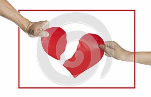 The hands of people tearing the heart apart in a red frame. Valentine`s day concept. Torn heart. On isolated background