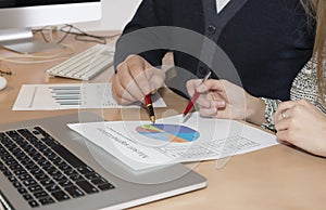 Hands of people working on presentation