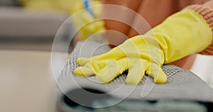 Hands, person and cloth for cleaning table in house living room for virus safety, bacteria and furniture dirt. Gloves