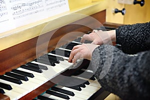 Hands with piano keyboard