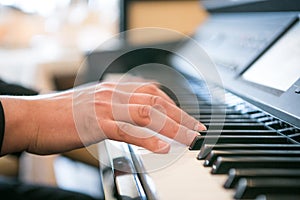 The hands of a piano playing guy