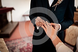 Hands, picture of man and woman with wedding ring, church wedding ceremony,love