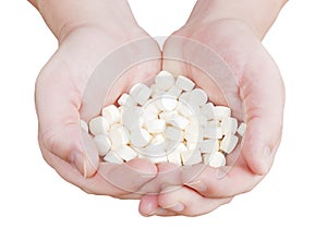 Hands with pills. Isolated on white