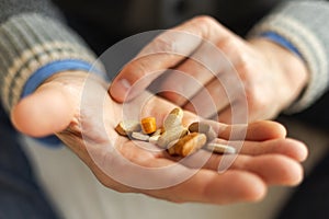 Hands with pills. Senior man hands holding medical pill. Mature old senior grandfather taking medication cure pills