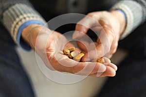 Hands with pills. Senior man hands holding medical pill. Mature old senior grandfather taking medication cure pills