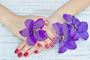 Hands with pink manicured fingernails