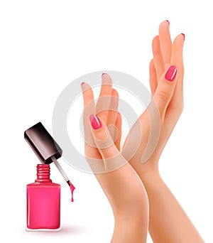 Hands with pink polished nails. Nail polish bottle.