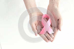 Hands with pink ribbon