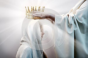 Hands placing a crown on a woman`s head