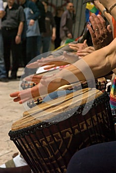 Hands playing drums during street concert