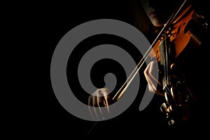Hands playing violin closeup