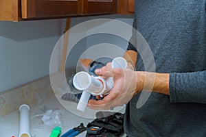 hands plumber at work in install a kitchen sink, plumbing repair service, assemble and install