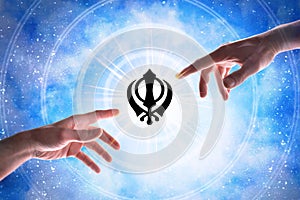 Hands pointing sikhism symbol with blue universe background