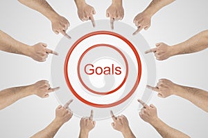 Hands pointing to word - goals.Goals achievement concept on white background