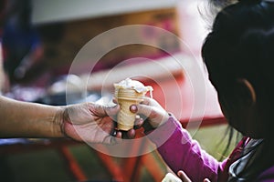 The hands of the poor handed a plate to receive food from volunteers to alleviate hunger, the concept of helping the homeless