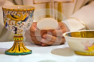 Hands of the pope celebrated the Eucharist