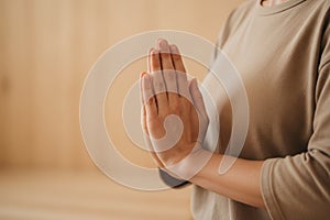 Hands in prayer position during meditation