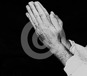 Hands in prayer with rosary beads 5 in black and white