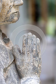 Hands in prayer. Selective focus on praying hands of memorial statue