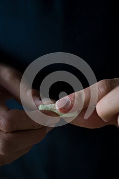 Hands preparing pasta